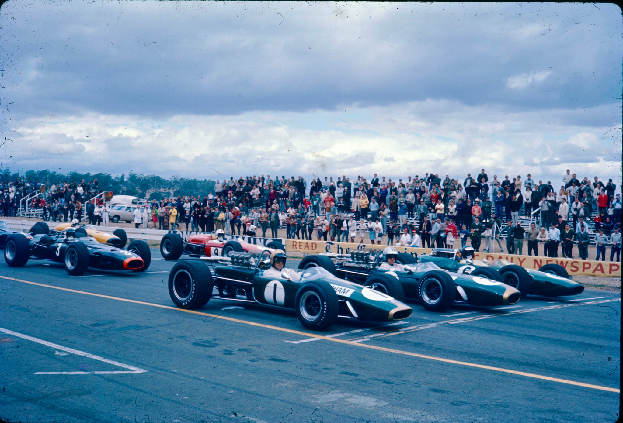 1967 grid shows Jack Brabham, Denny Hulme both in Repco Brabhams, Jim Clark front row in a Lotus Climax V8, Jackie Stewart in BRM P261 V8 and Spencer Martin in Brabham Climax second row<